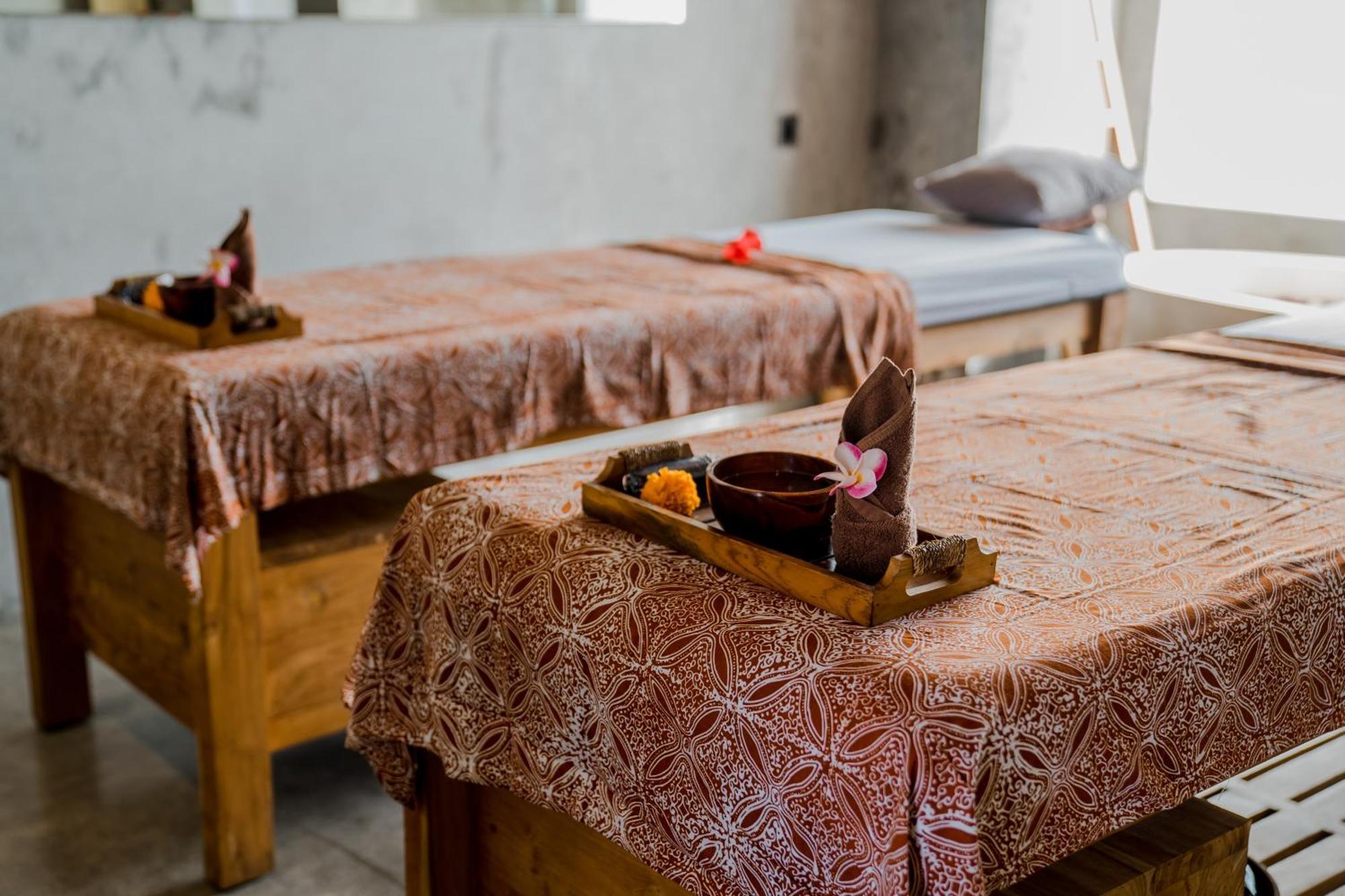 Purana Suite Ubud Exterior photo Massage beds at a spa